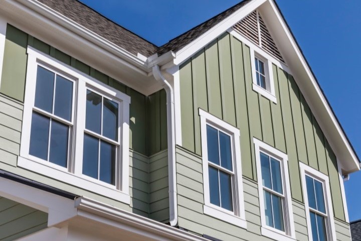 A home with green viny; siding